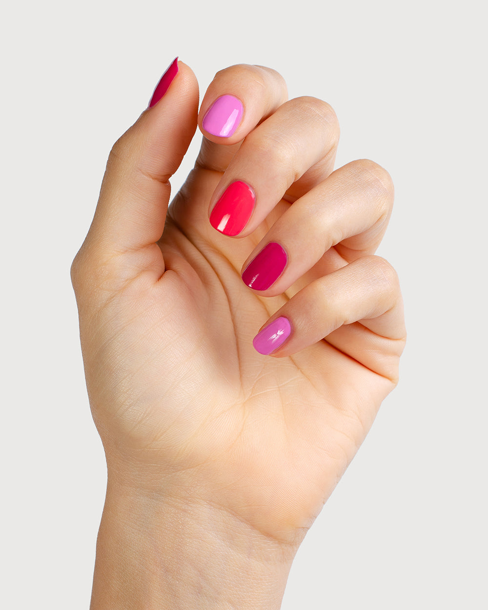 Close up crush trio painted on fair skin tone hand